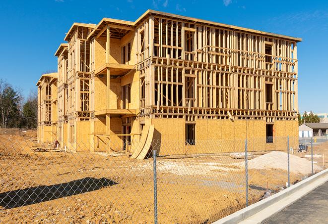 a snapshot of temporary chain link fences protecting a large construction project from unauthorized access in Danvers, MA